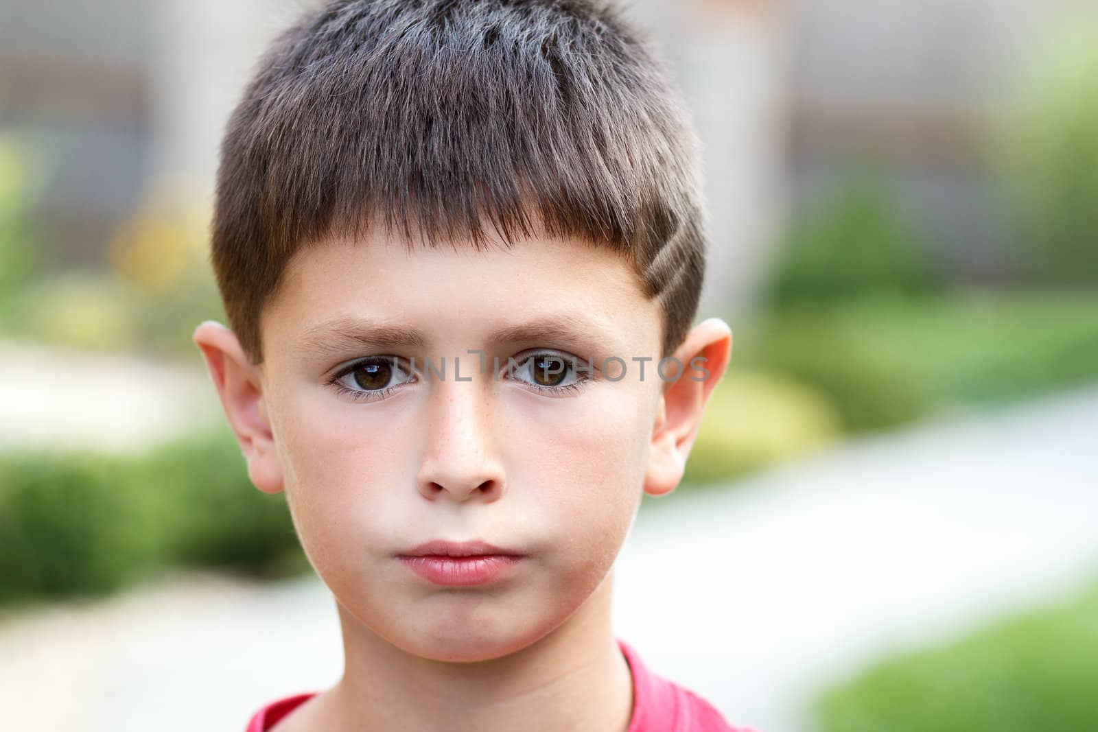 outdoor portrait of young teenager boy with shallow focus