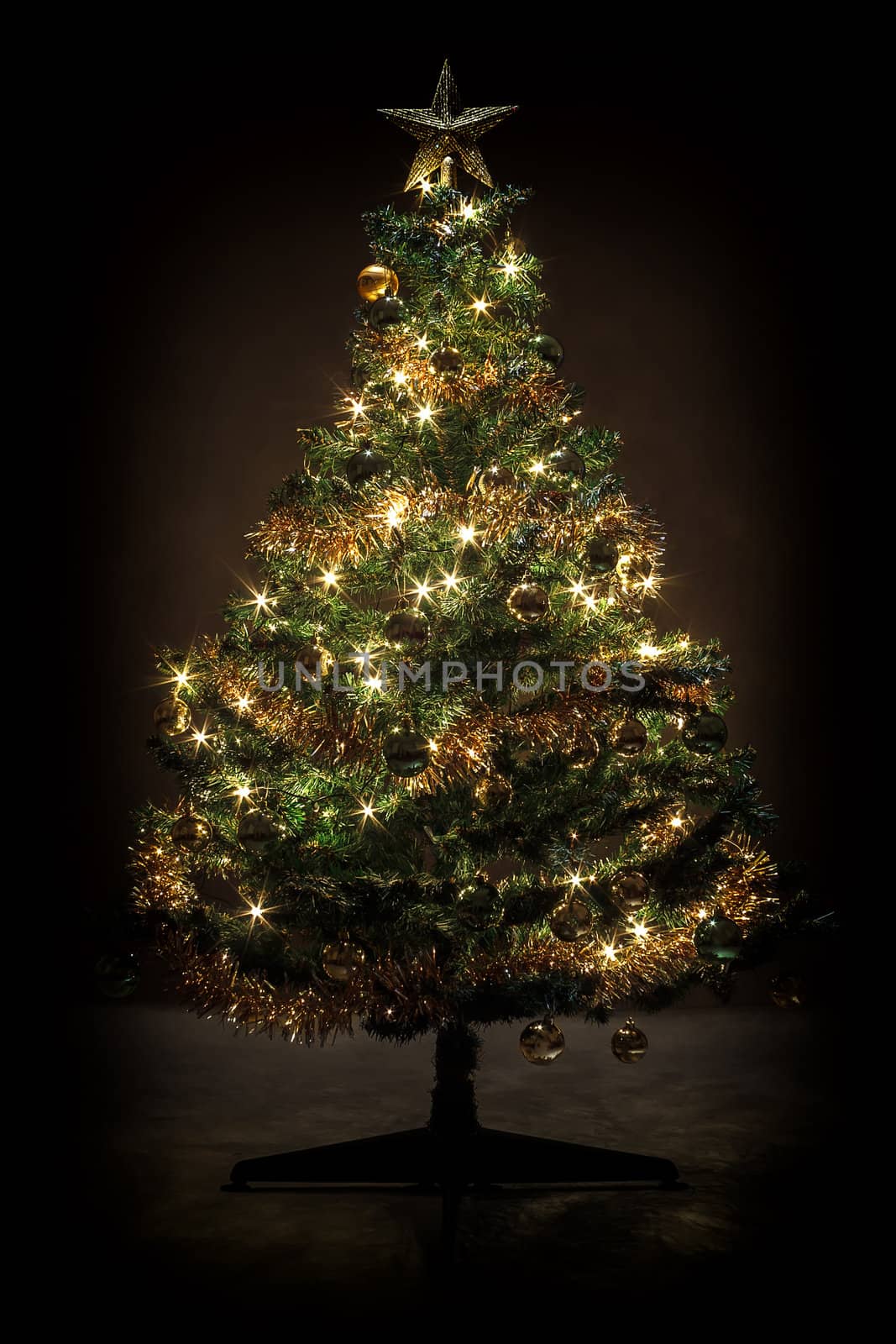 Decorated christmas tree with yellow and green balls