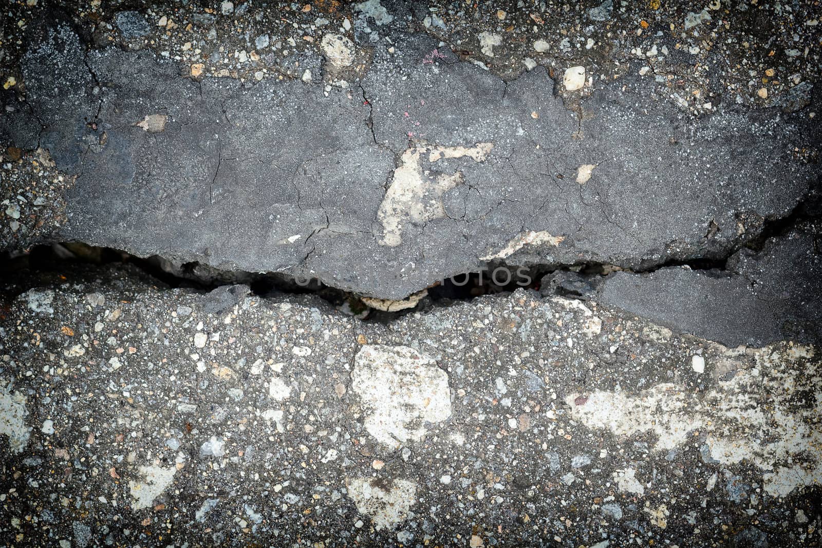 grunge old cracked asphalt closeup background. 
