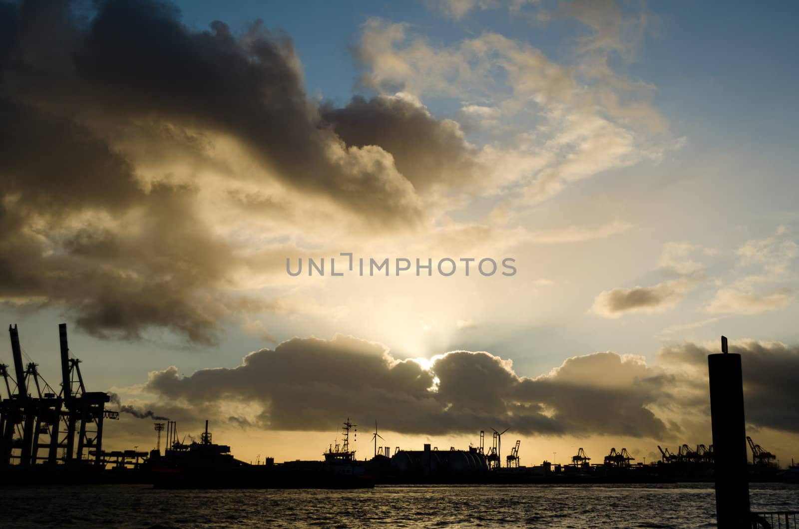 Sunset over the harbour of Hamburg, Germany