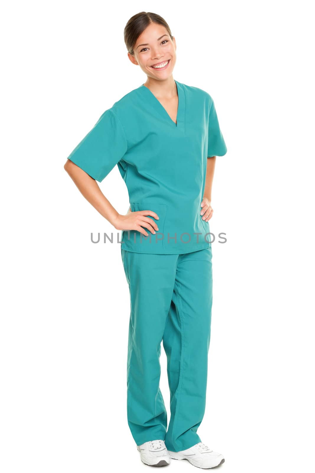 Medical nurse isolated in full body length in green scrubs on pure white background. Multiracial Asian and Caucasian female medical professional doctor or nurse smiling happy and joyful