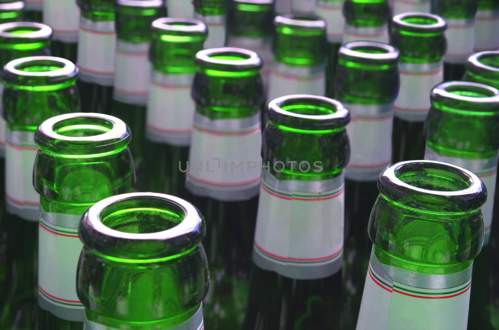 An array of green beer bottles.