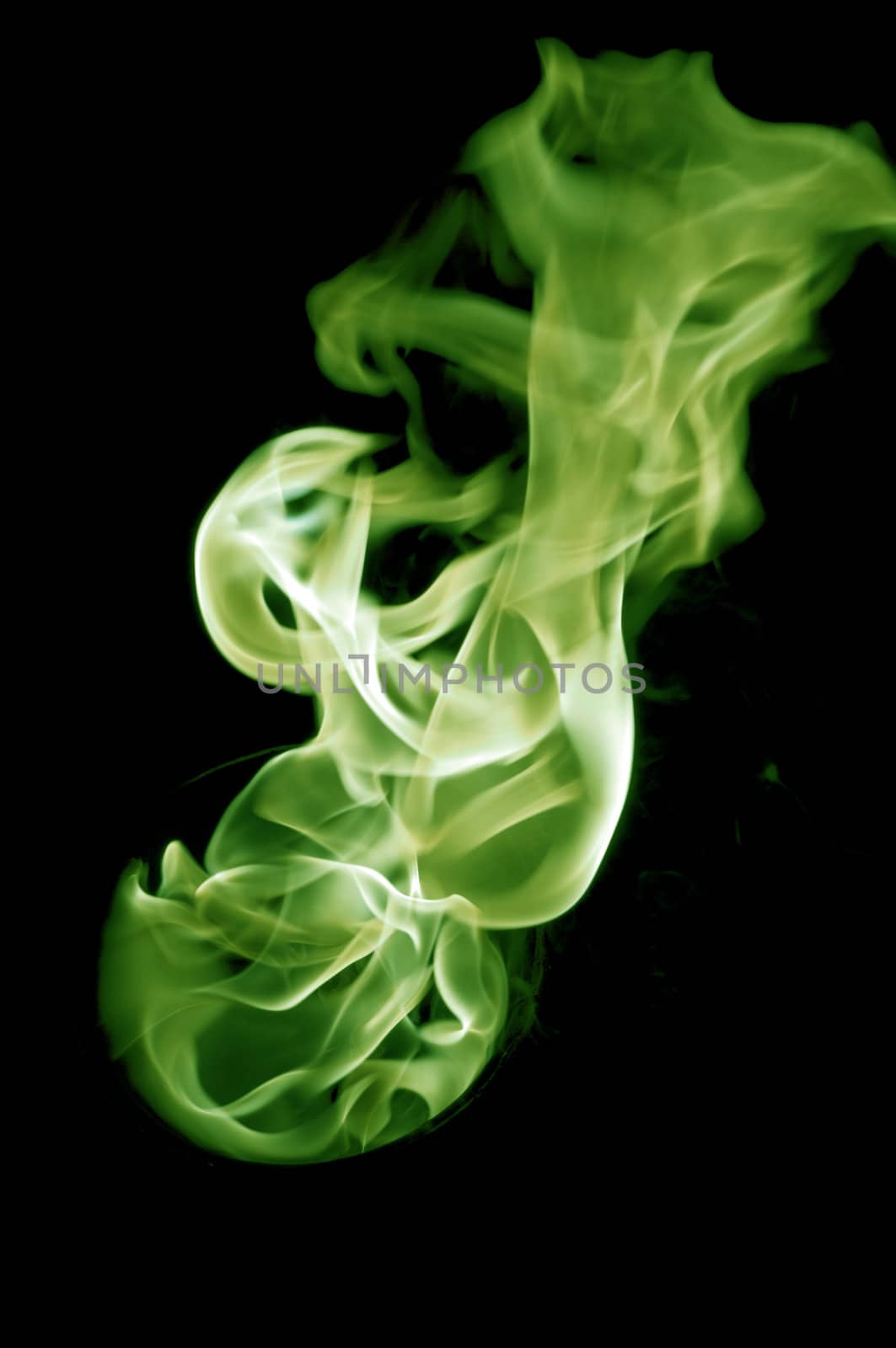 greenish fire with a black background, abstract background.