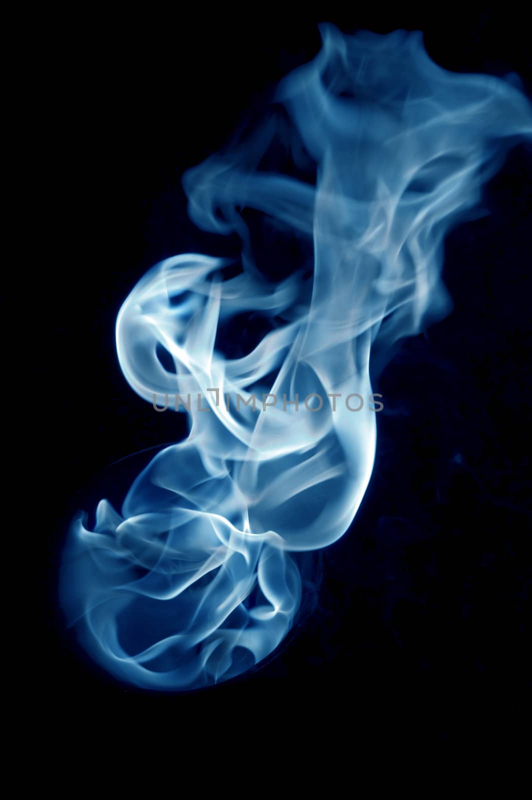 bluish fire with a black background, abstract background.