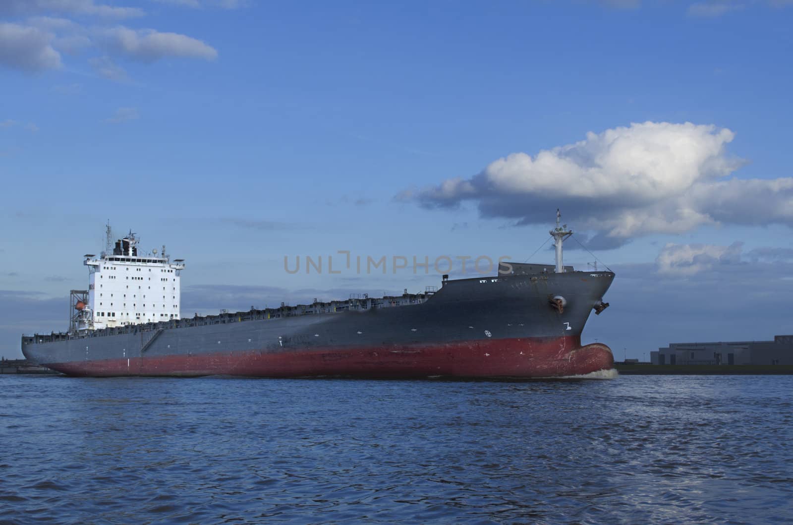 An empty container vessel leaving the harbor of Hamburg.