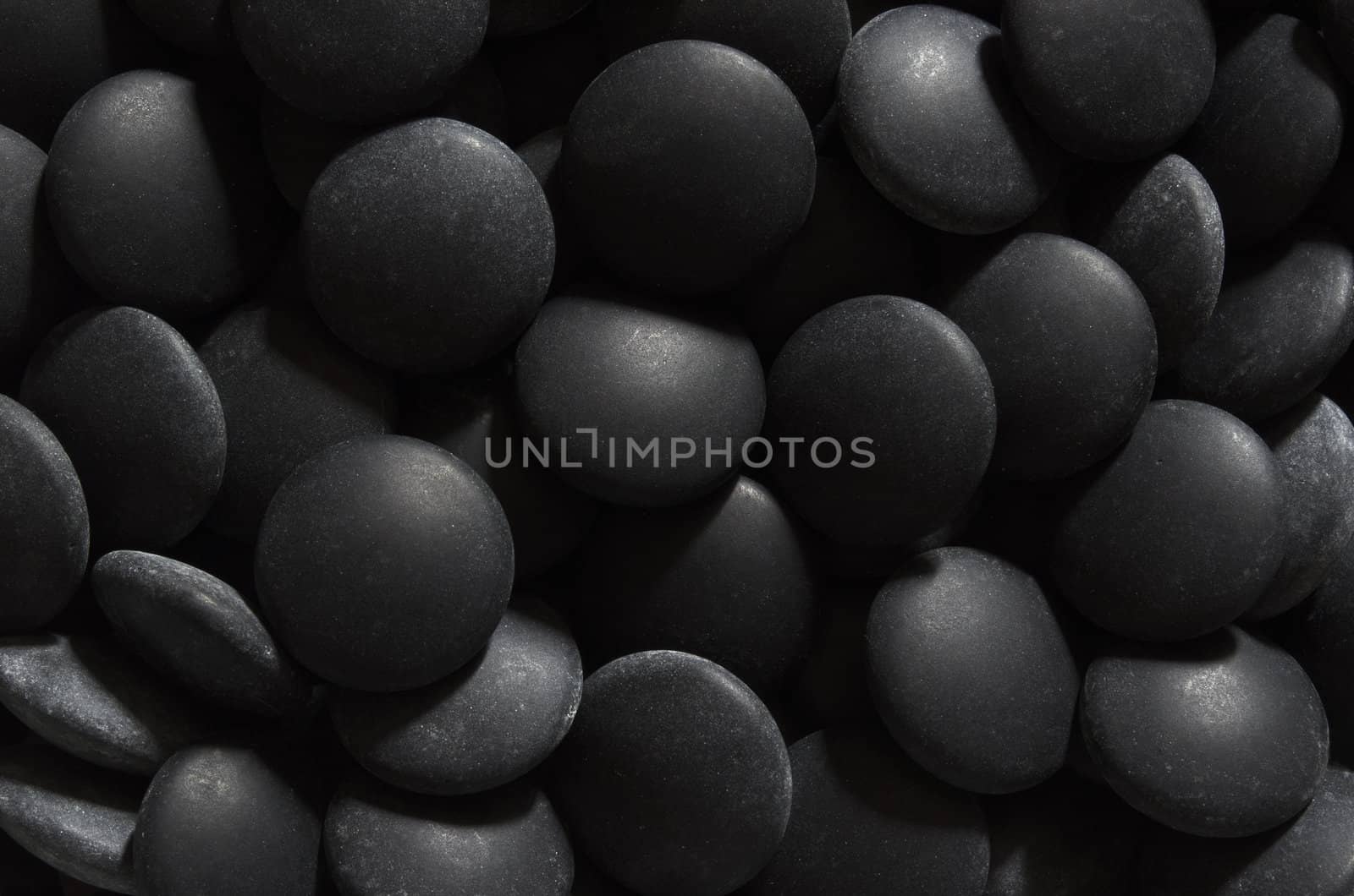 A pile of black stones, used in the traditional Chinese strategy game go.