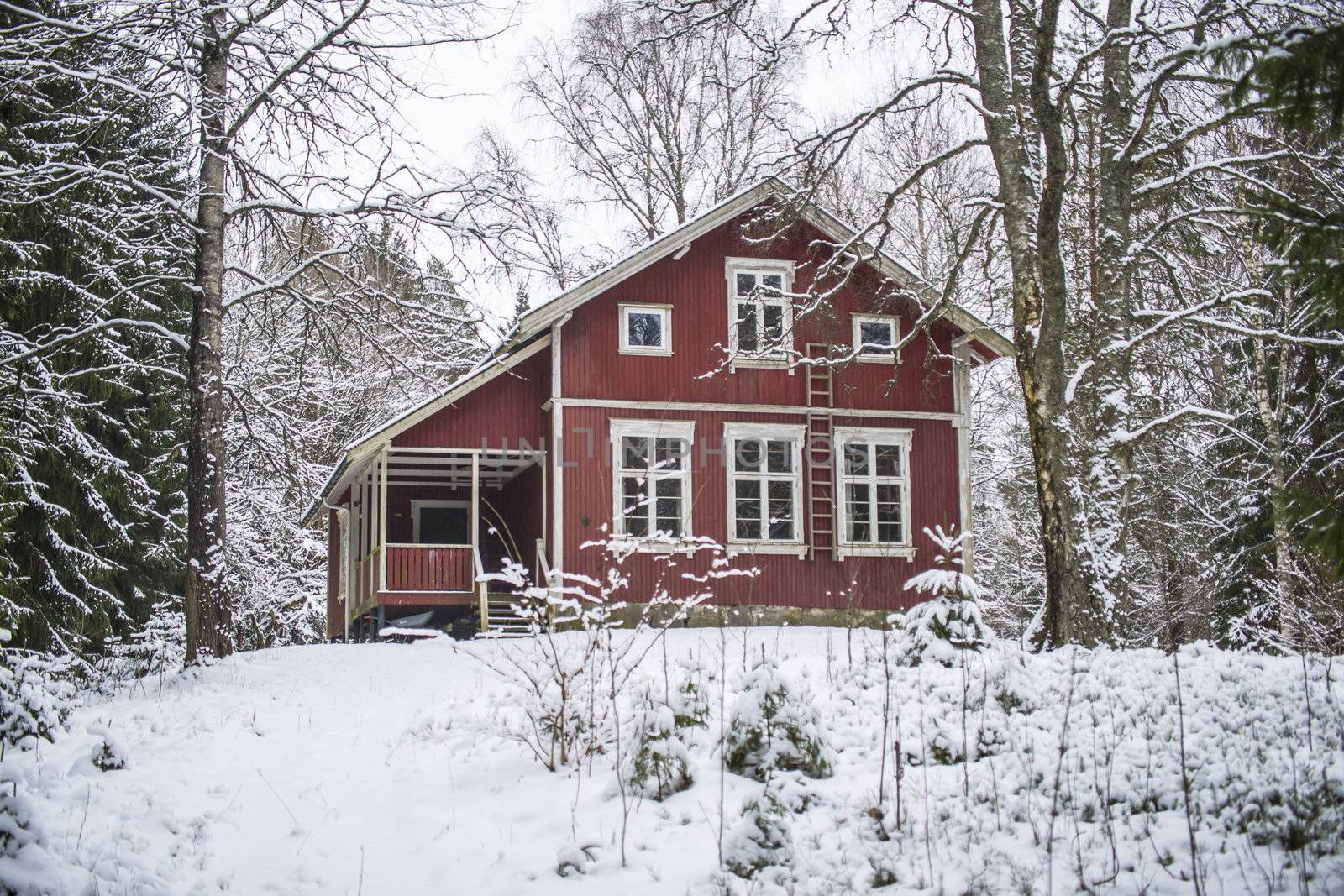 in the middle of the forest at "brekke" has Halden scout association their own big red wooden house, the image is shot one day in february 2013