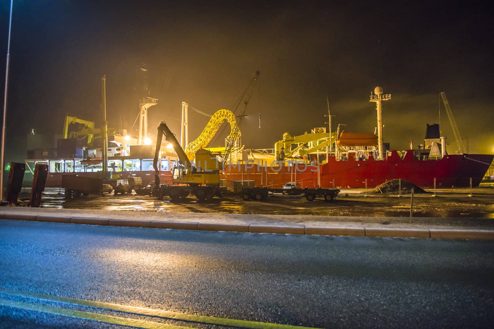 the picture is shot in january 2013 in the evening and shows mv nexans skagerrak which is currently docked at Halden harbor for inspection, maintenance and repairs, the fog was quite tightly and the image got a mysterious touch