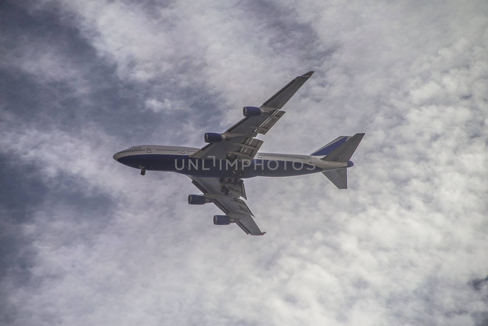 the image is shot over the airspace in sharm el sheikh, egypt and shows a large 4-engine jetliner, january 2013.