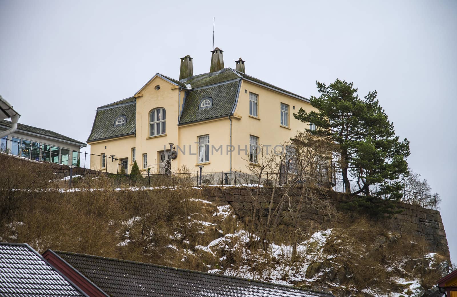 "Petersborg" was built by Ole Dahl in 1914 and which was a rich shoemaker, the building is walled up in bricks and plastered. the house is situated on top of a rocky hill with a view to the harbor and  Halden city, the image is shot in december 2012