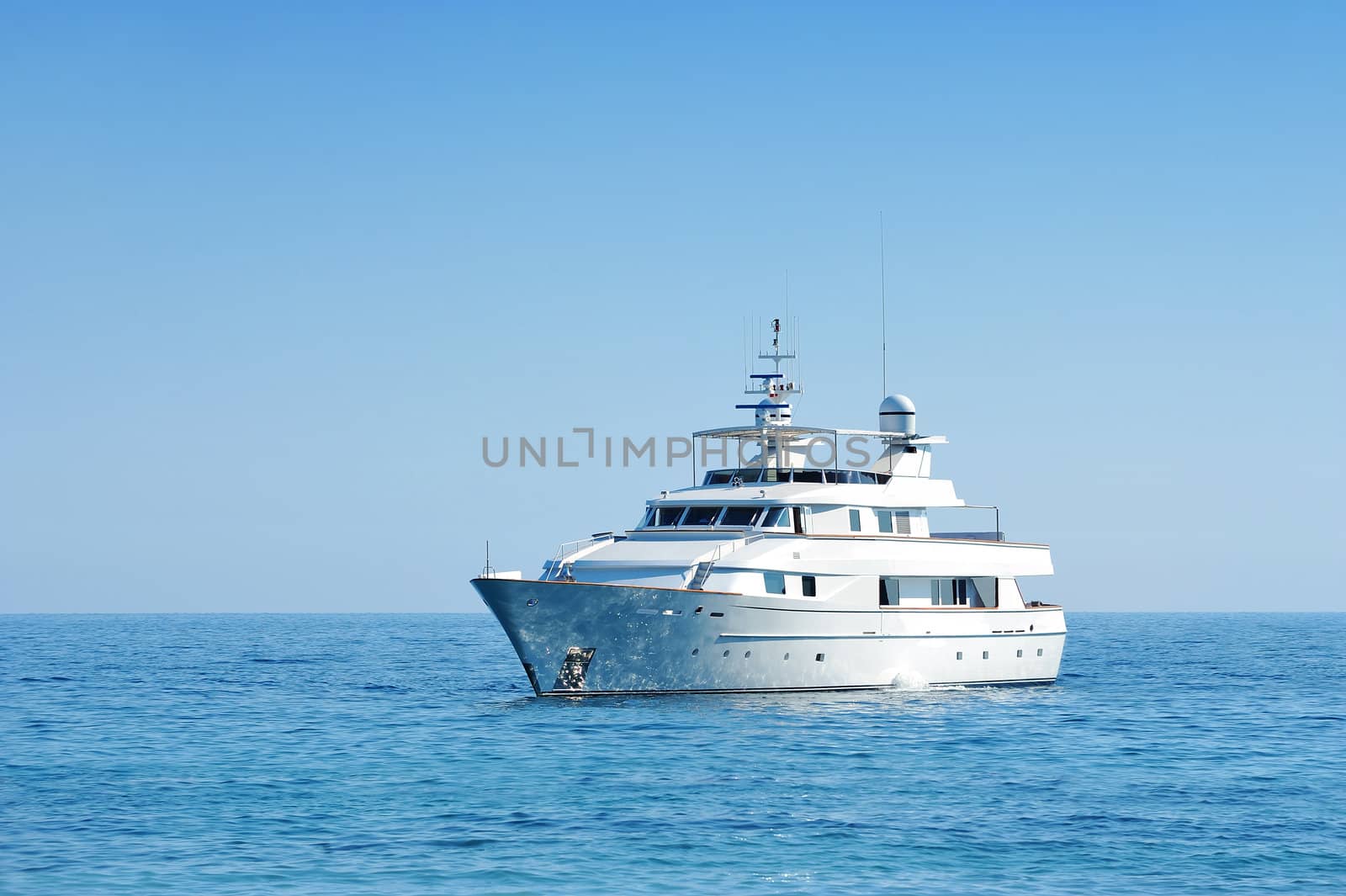 Side view of luxury motor yacht at open sea with copy space