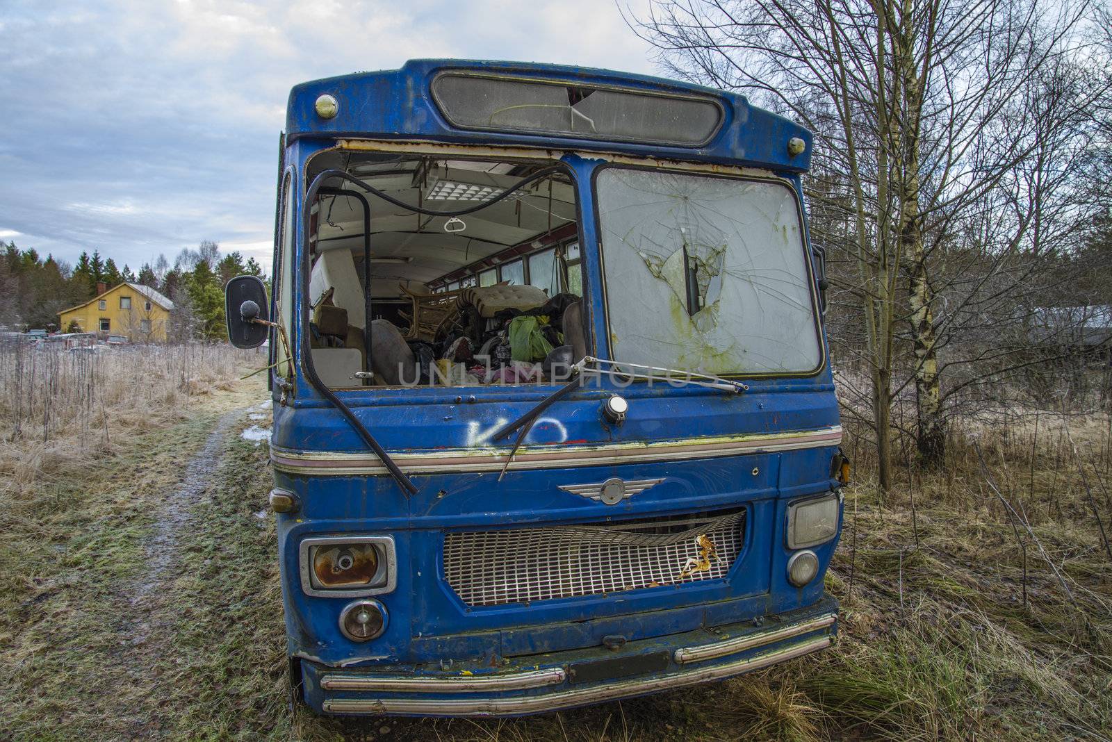 the pictures are shot in January 2013 and shows different car wreck on a scrapyard for cars somewhere in sweden