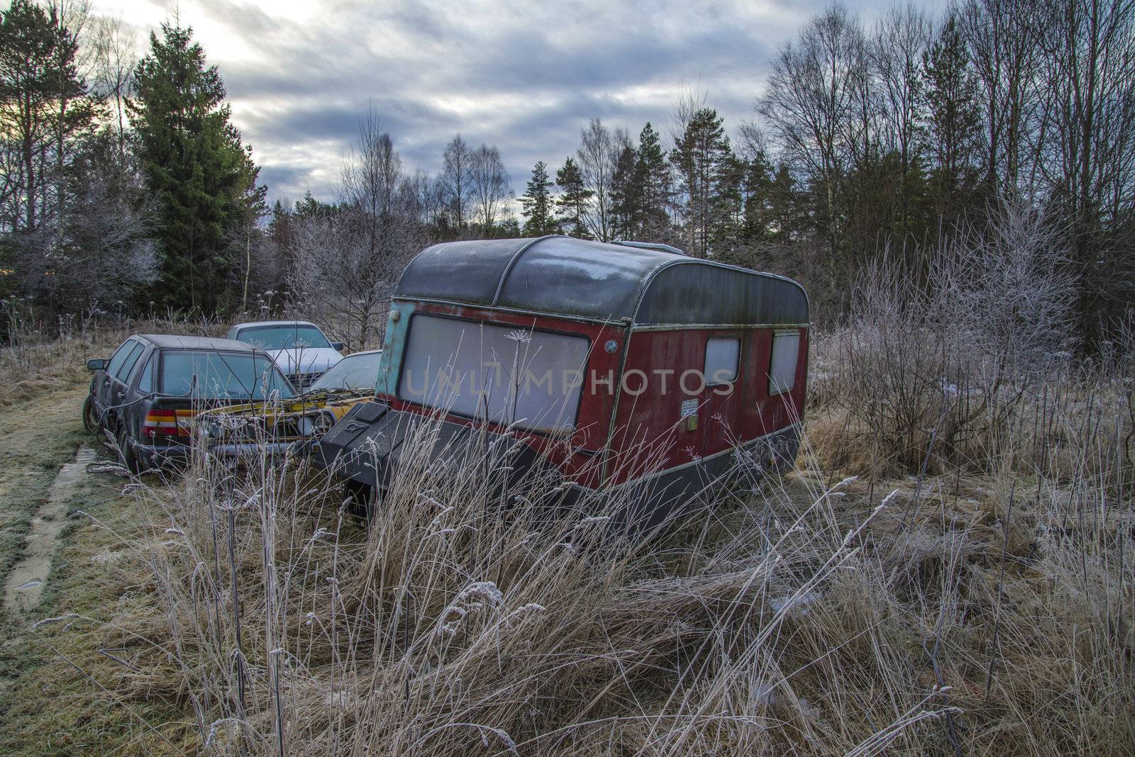 the pictures are shot in january 2013 and shows different car wreck on a scrapyard for cars somewhere in sweden