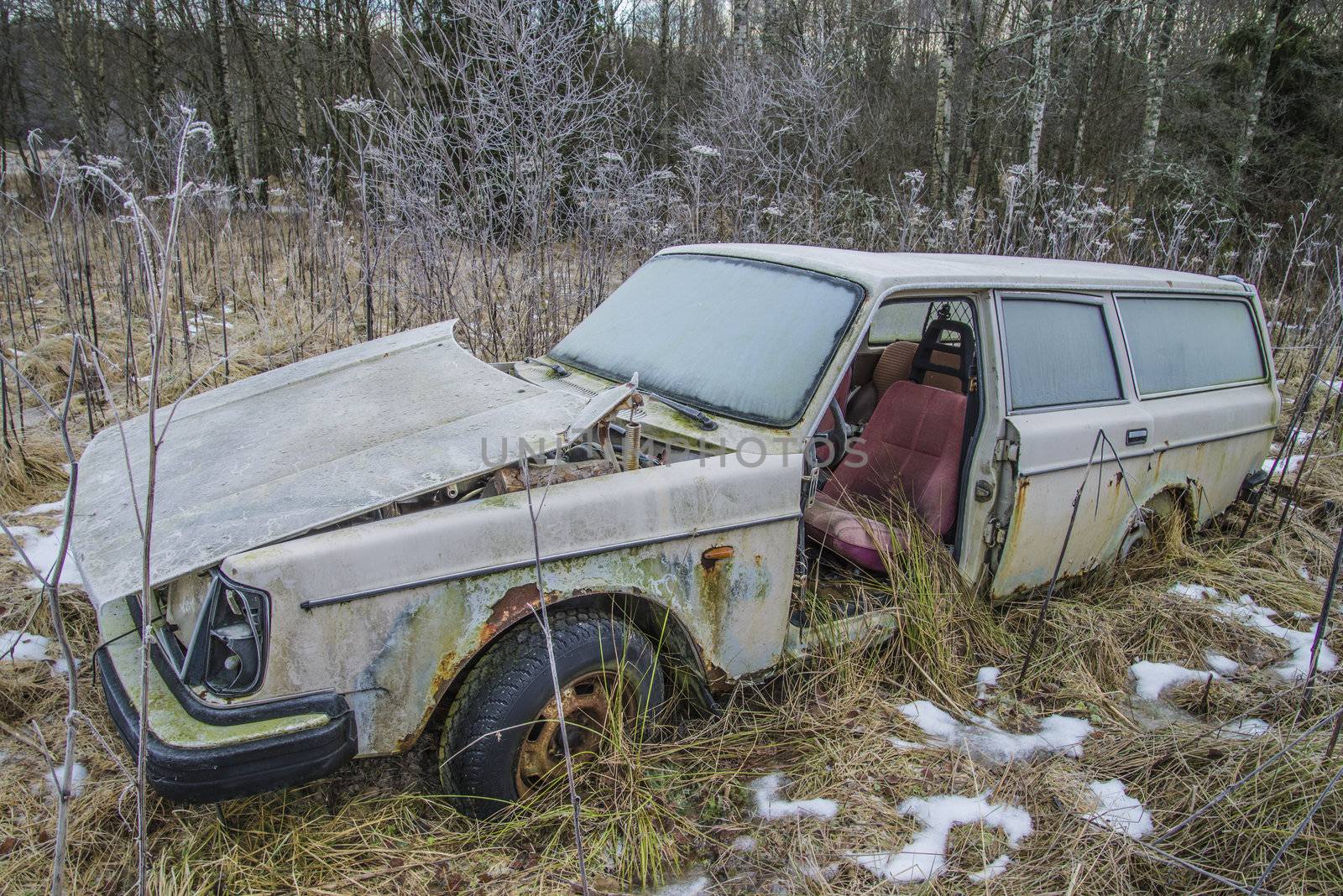 the pictures are shot in January 2013 and shows different car wreck on a scrapyard for cars somewhere in sweden