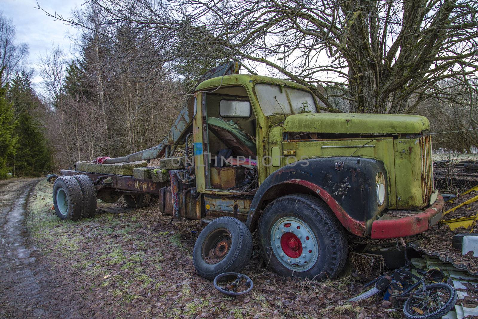 the pictures are shot in January 2013 and shows different car wreck on a scrapyard for cars somewhere in sweden