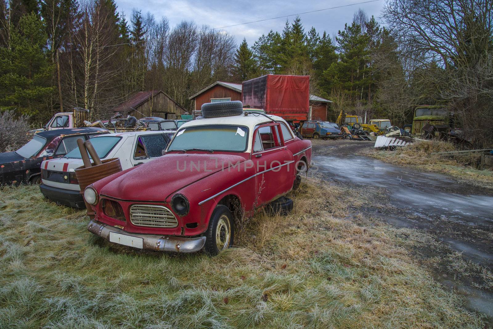 the pictures are shot in january 2013 and shows different car wreck on a scrapyard for cars somewhere in sweden