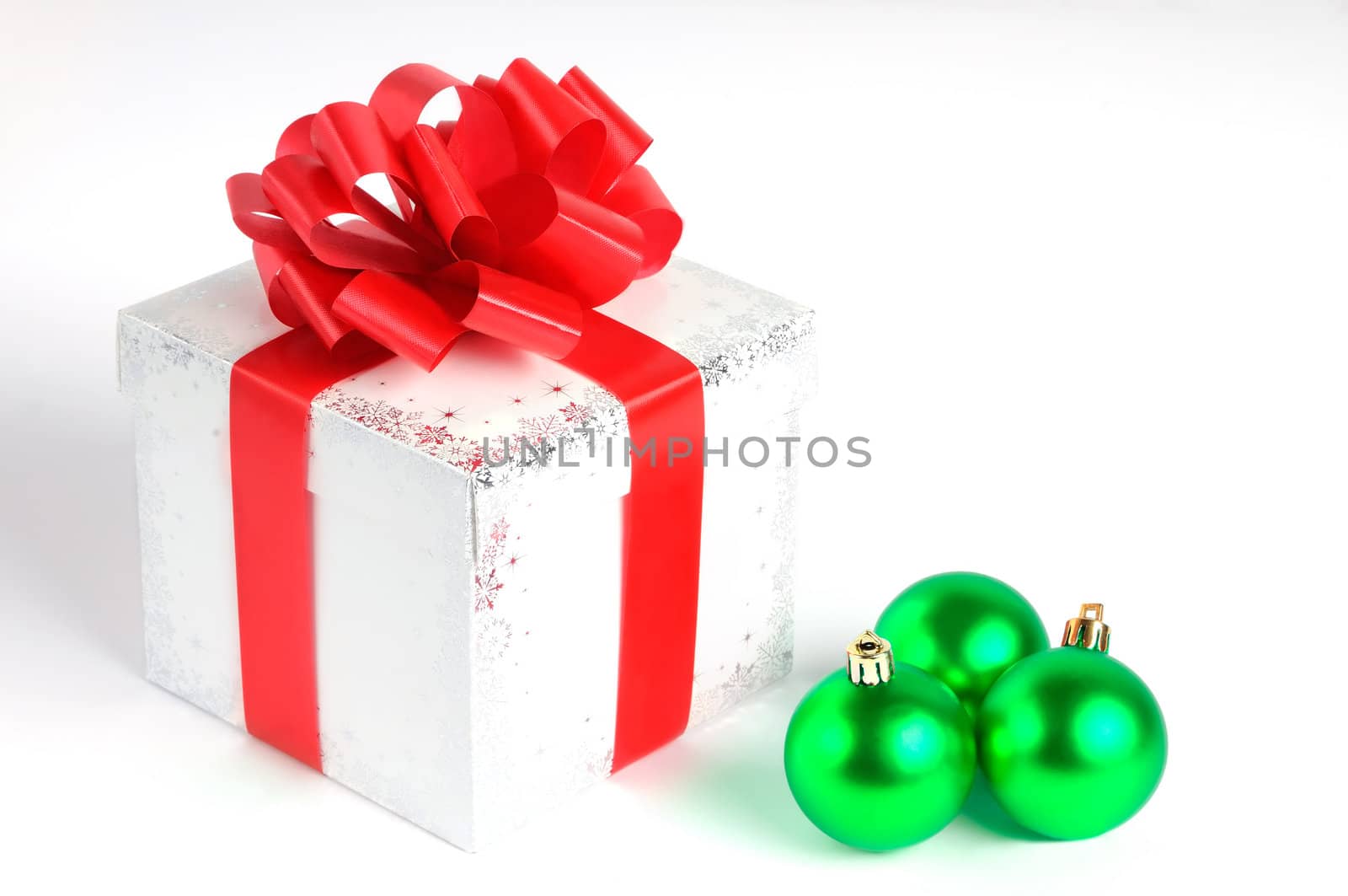 Colorful gift with Christmas balls isolated on white, red and green