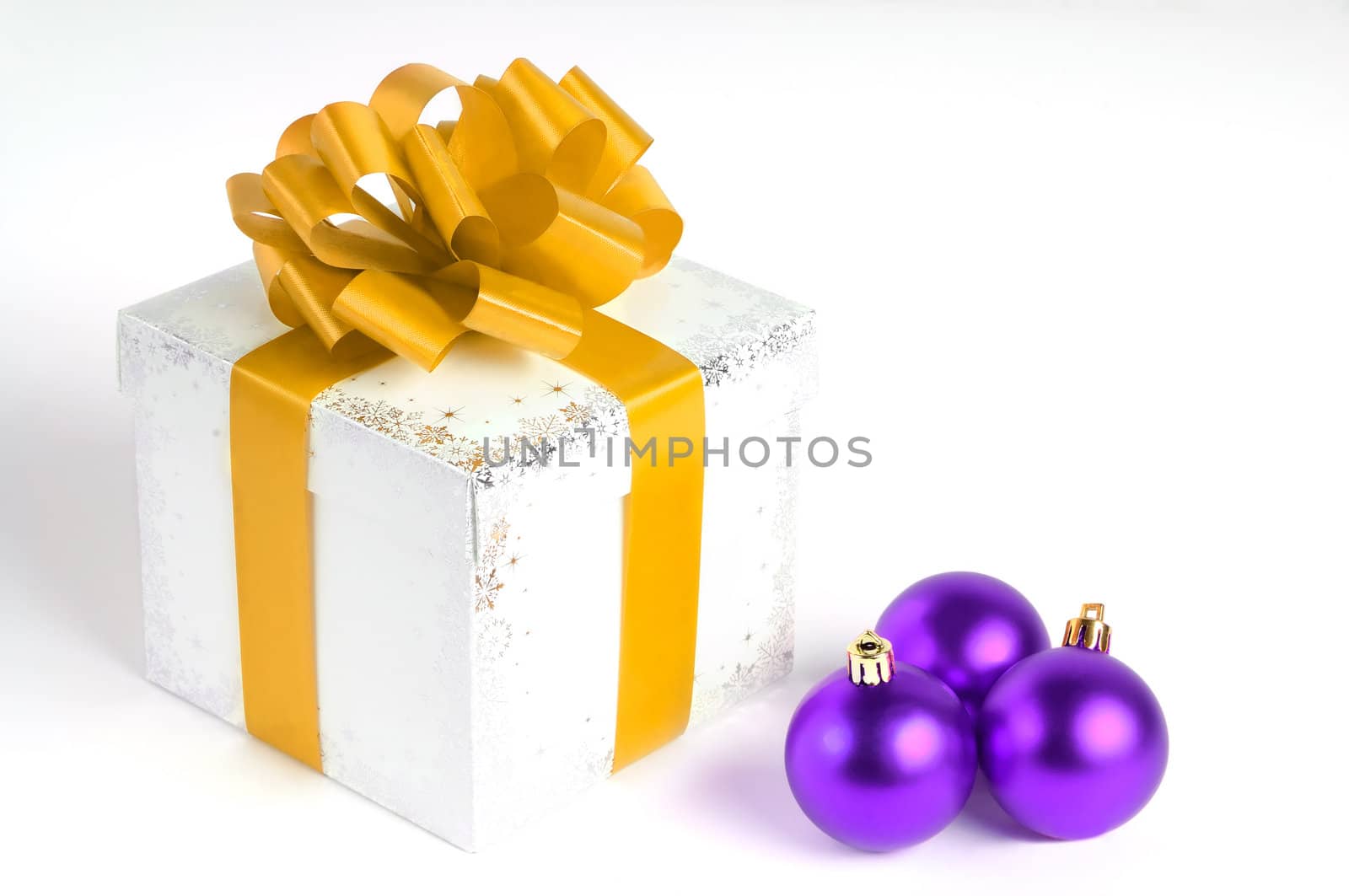 New year gift box isolated on white with Christmas balls, yellow and purple