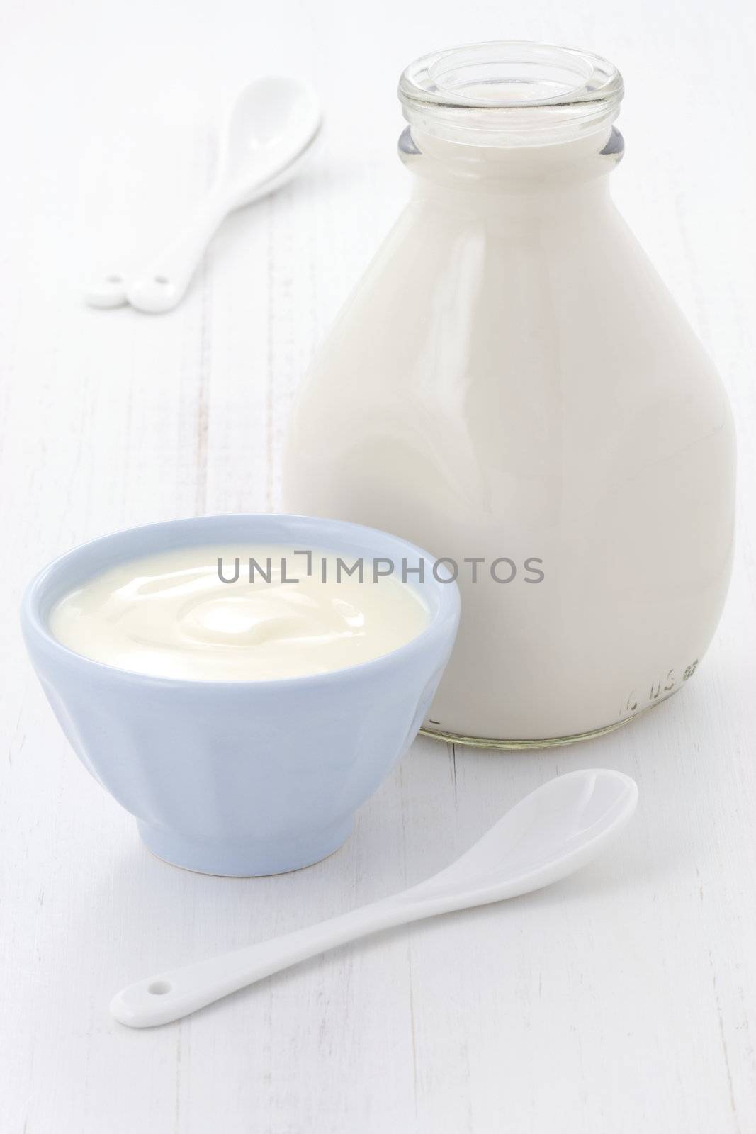 Delicious, nutritious and fresh plain yogurt and milk bottle.