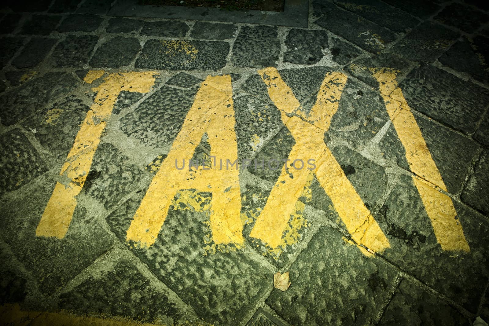 Taxi -  text painted in the street.