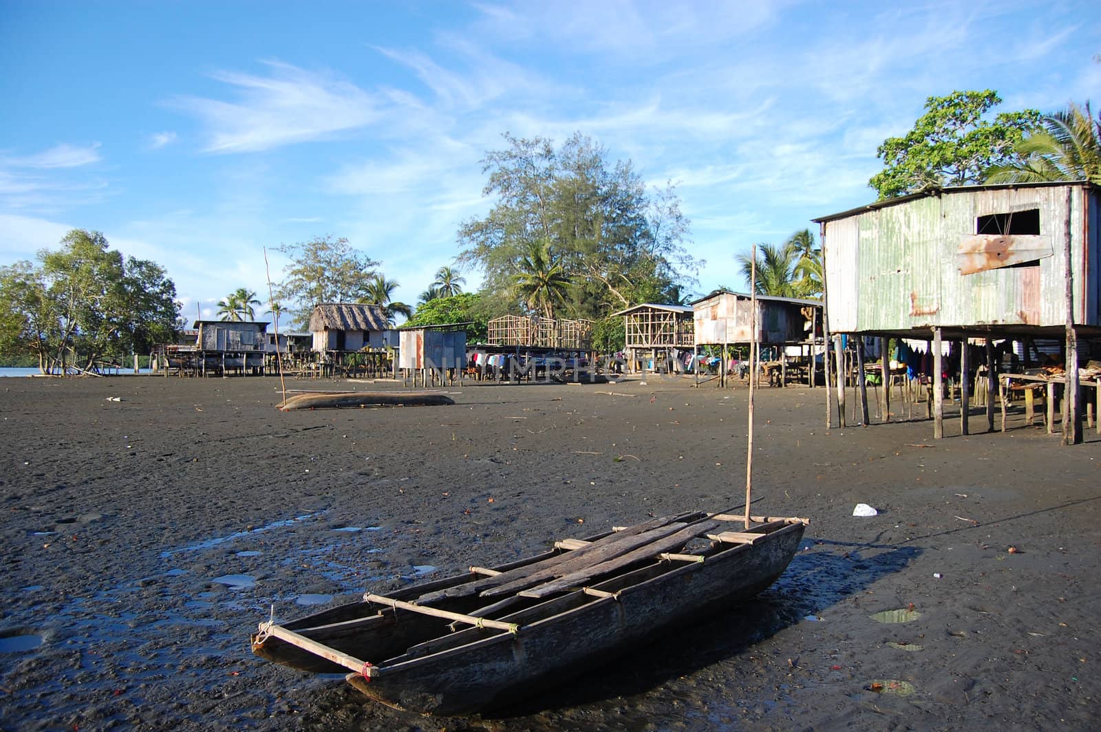 Canoe at village river coast, Papua New Guinea