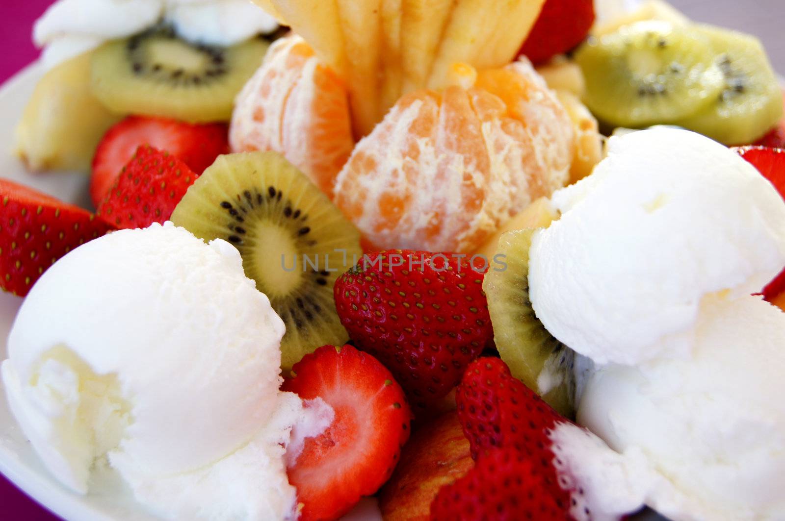 Fruit desert with cake and ice cream