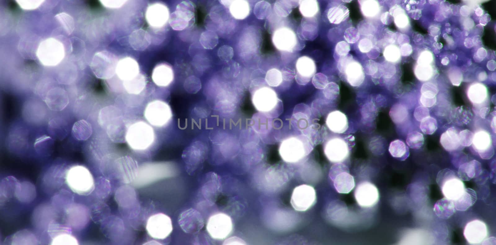 defocused abstract background of color night holiday lights by Elet