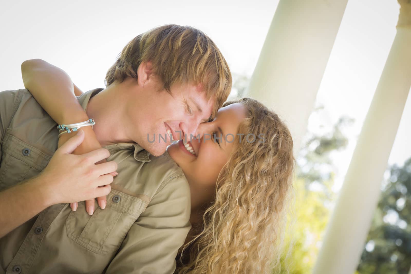 Happy Attractive Loving Couple Portrait in the Park.