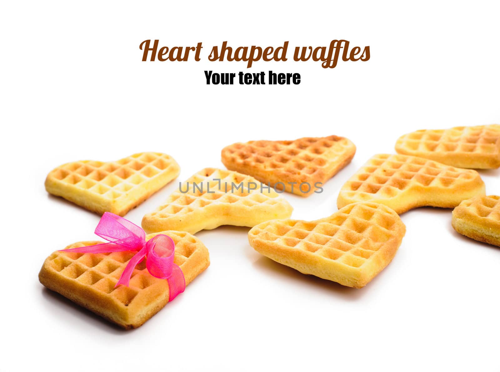 Heart shaped waffles with pink ribbon by nvelichko