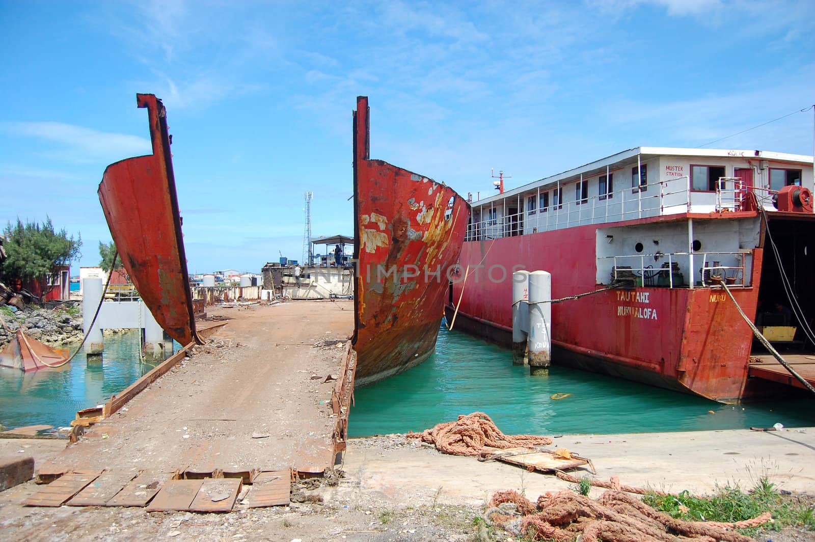 Abandoned red ships in port, Tonga Islands