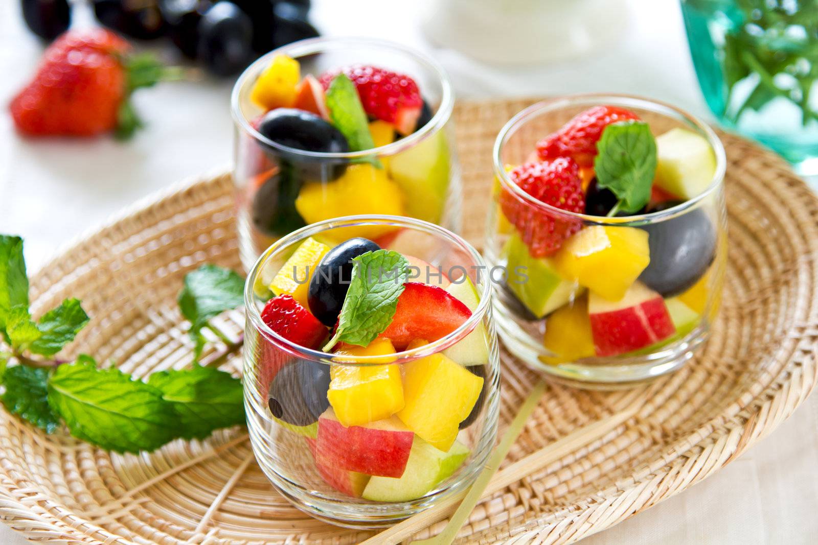 Varieties of fruits salad in small glass
