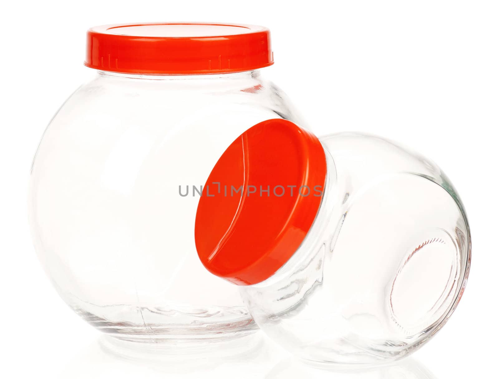 Empty glass jar with red cover isolated on white background