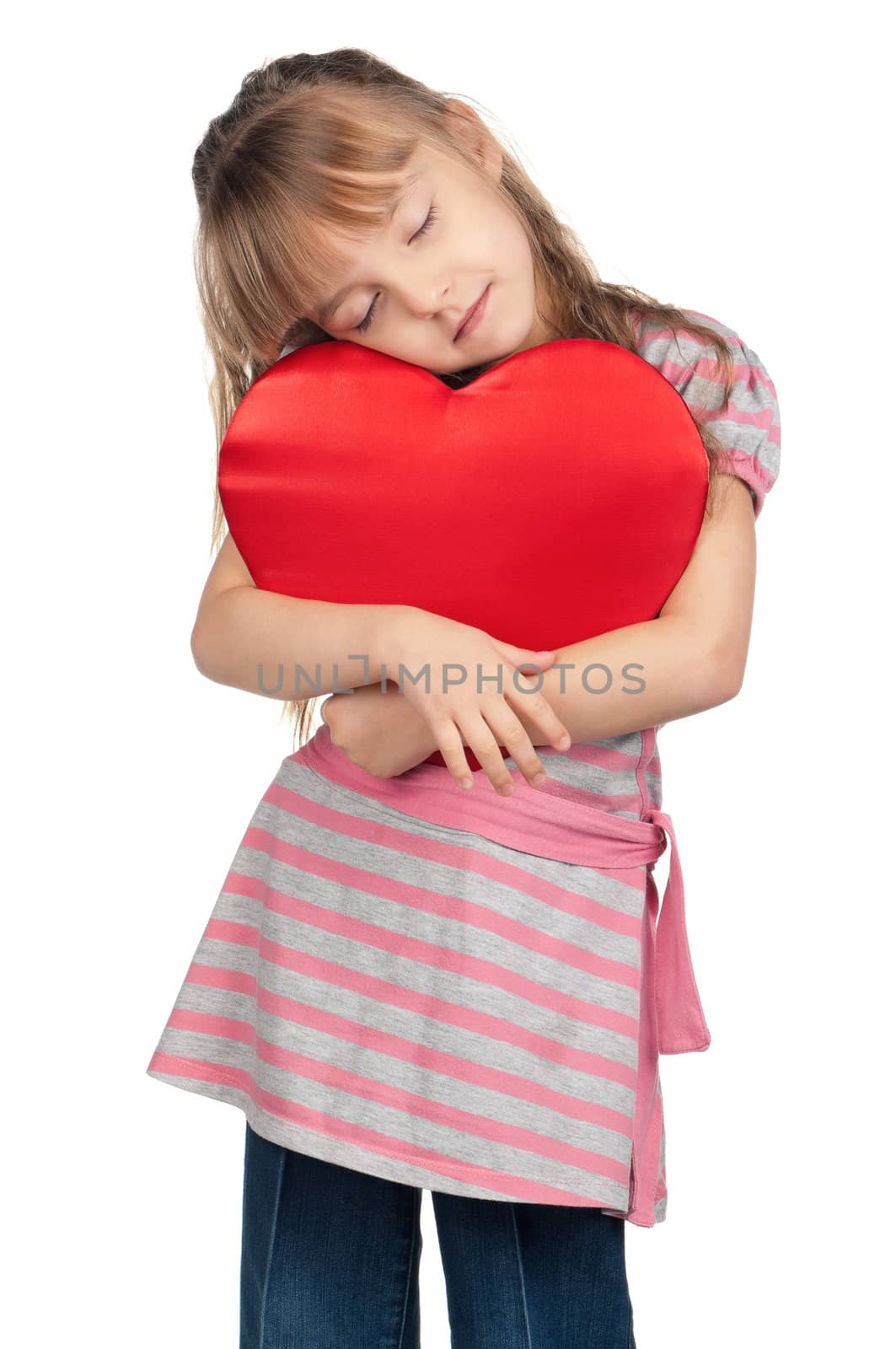 Portrait of little girl holding red heart over white background