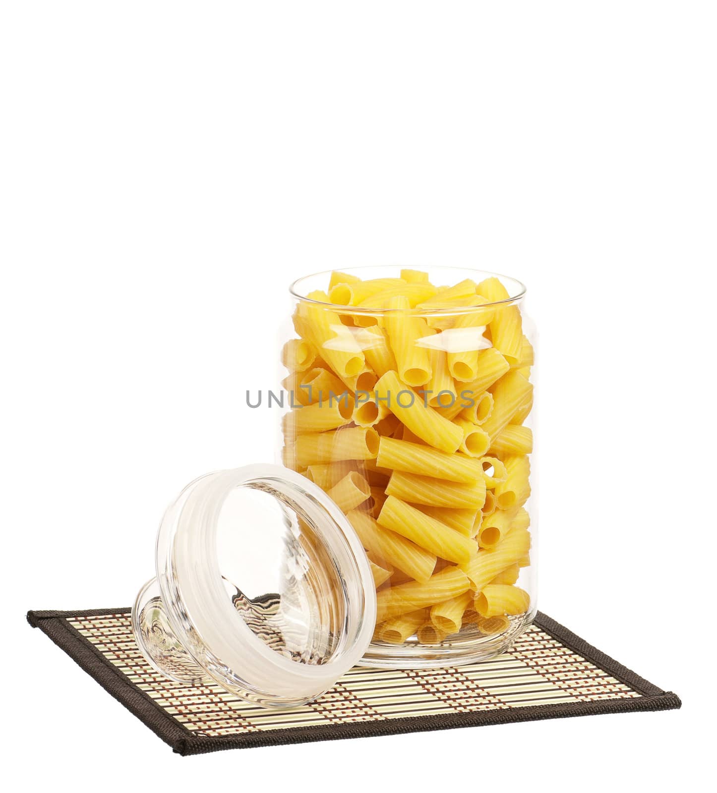 Pasta in glass pot isolated on white background