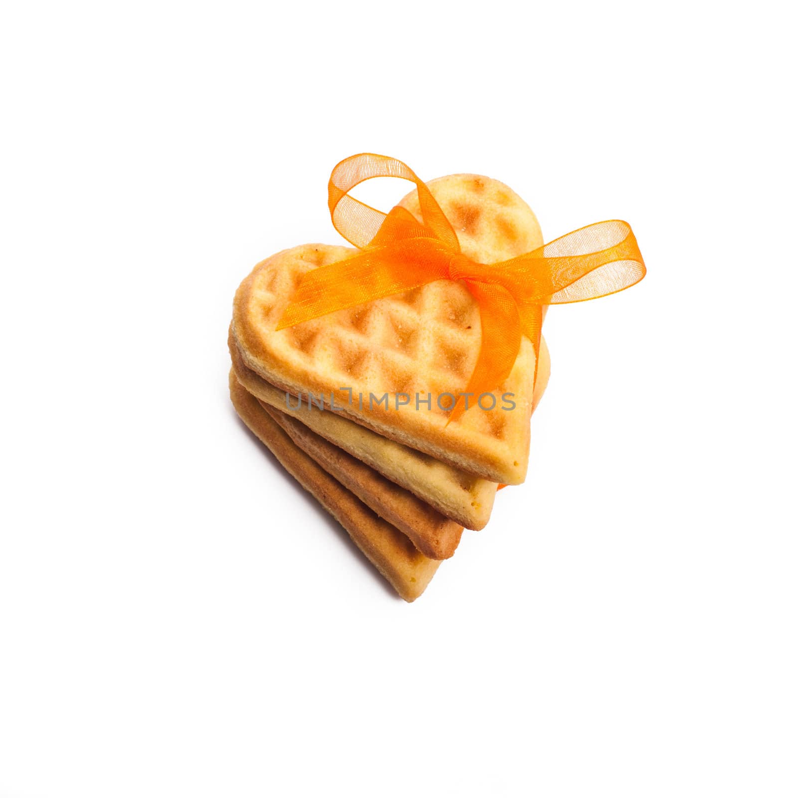 Stack of heart shaped waffles isolated on white background