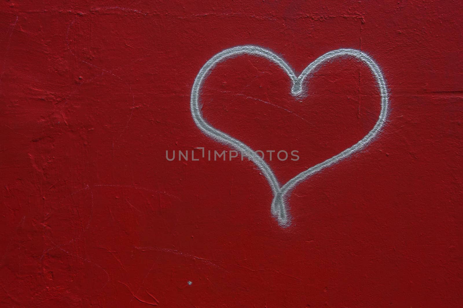Heart graffiti on a red wall