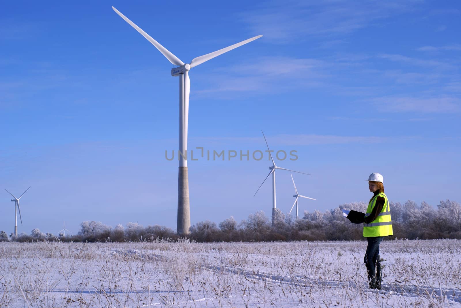 engineers with wind turbines by nostal6ie