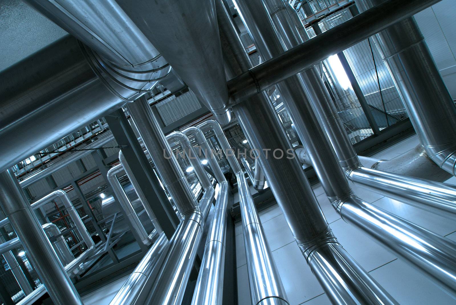 Equipment, cables and piping as found inside of  industrial power plant, b&w