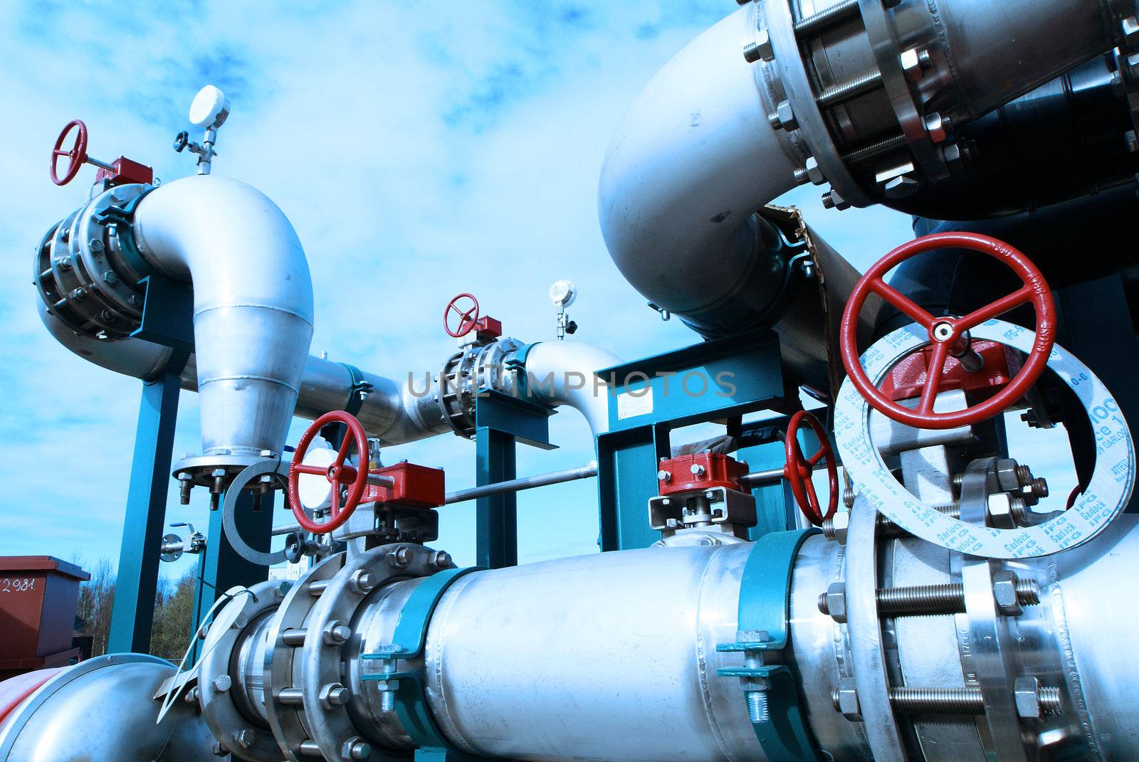 Equipment, cables and piping as found inside of  industrial power plant