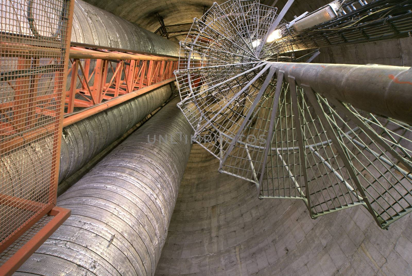 Equipment, cables and piping as found inside of  industrial power plant