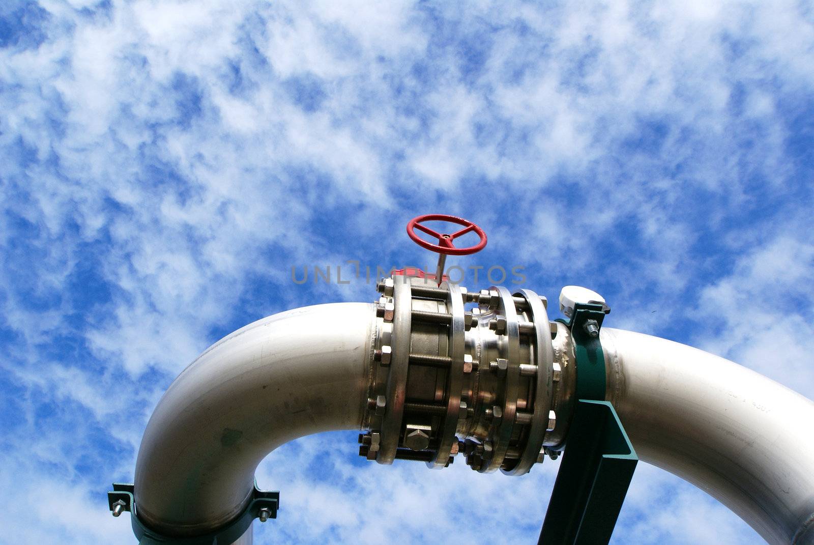 industrial pipelines and valve with a natural blue background