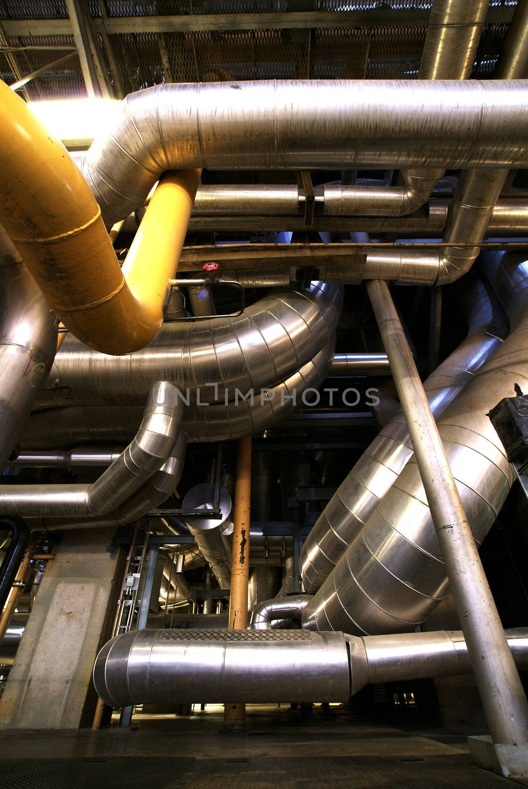 Equipment, cables and stairs as found inside of  industrial powe by nostal6ie
