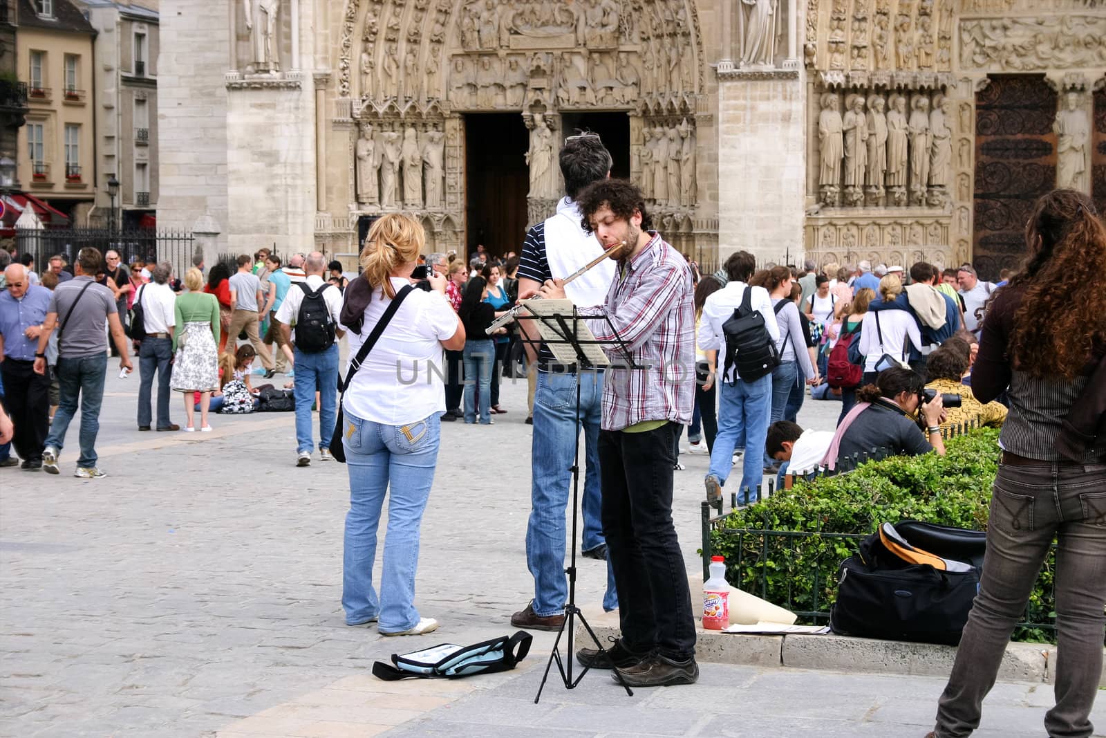 PARIS - May 7: Notre Dame Cathedral on May, 2009 in Paris. Unknown artist in front of the cathedral was essentially completed by 1345 and is very popular travel destination in France