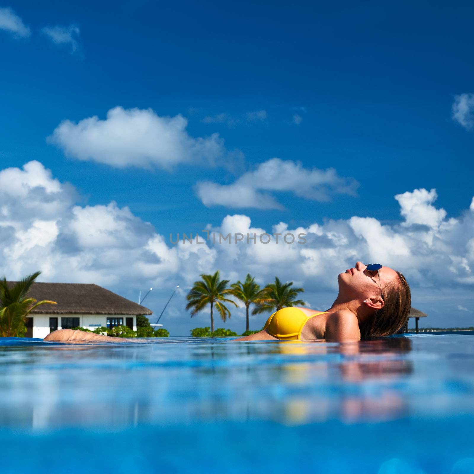 Woman at poolside by haveseen