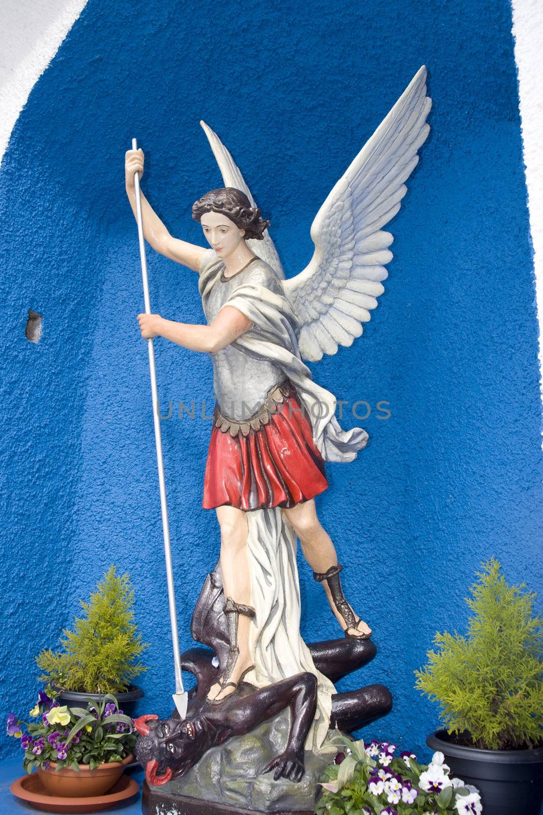 a statue of saint michael slaying the devil in county Kerry Ireland