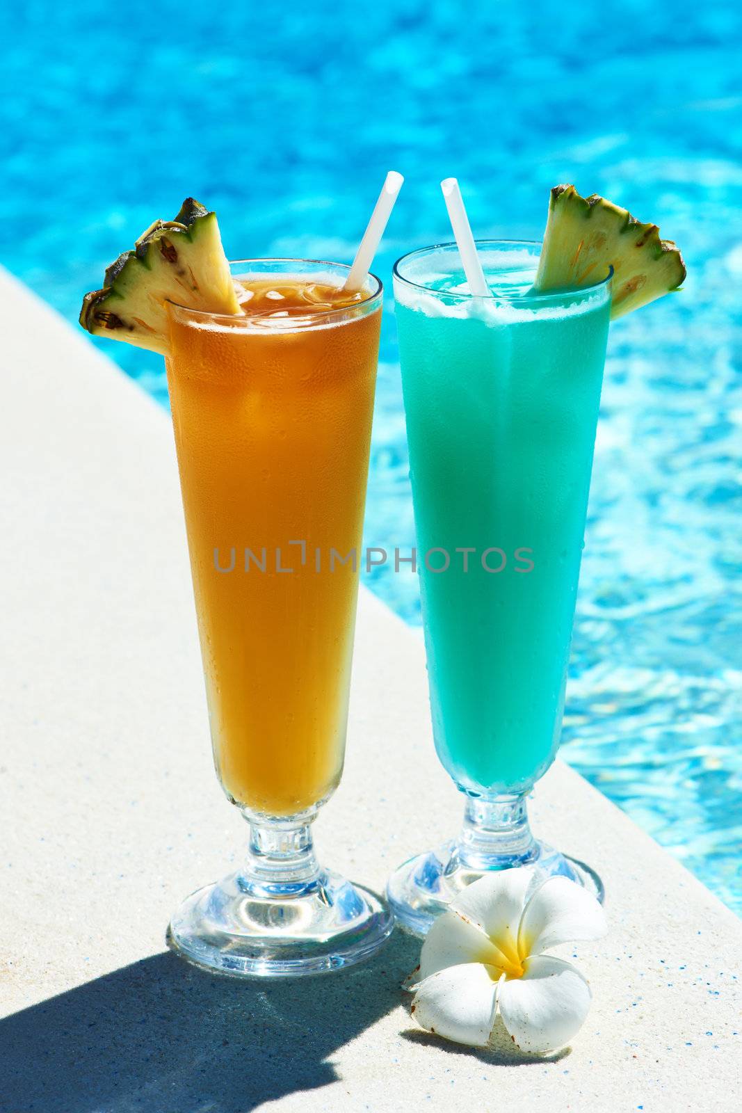 Cocktails near swimming pool by haveseen