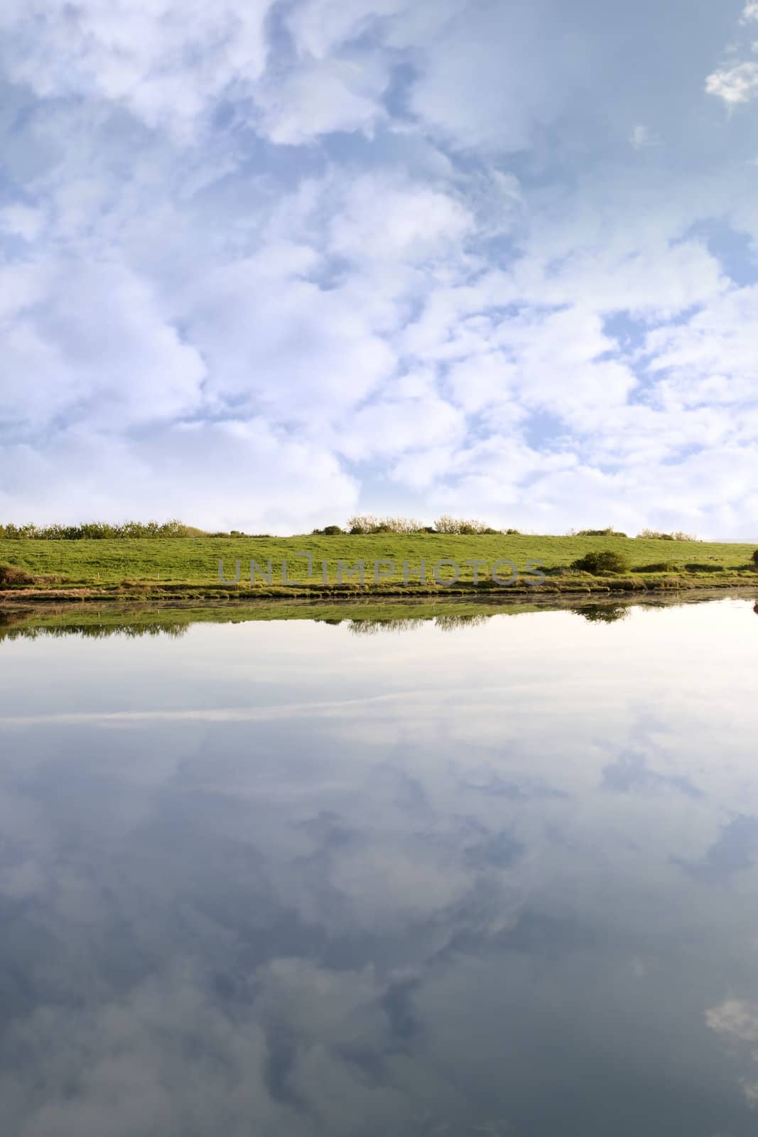 view of the Shannon estuary and fields from Salleen pier on a bright cloudy day