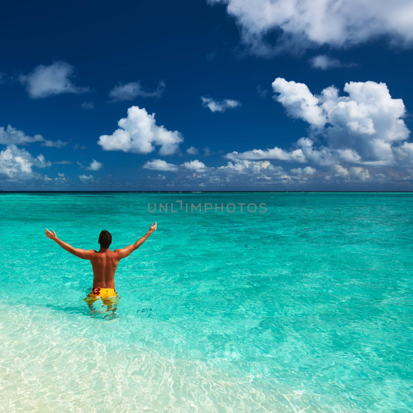 Man at tropical beach at Maldives