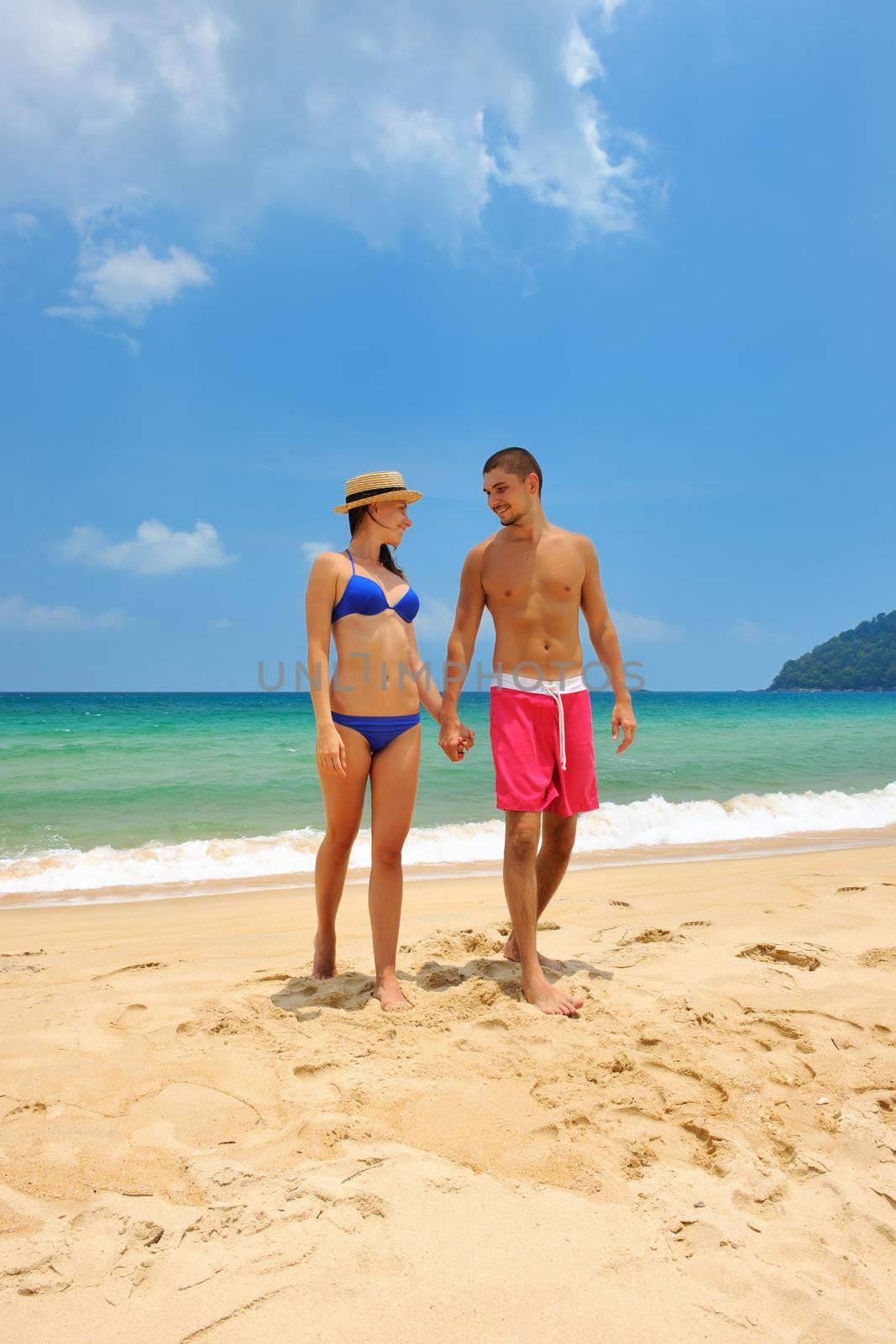 Couple on a beach by haveseen