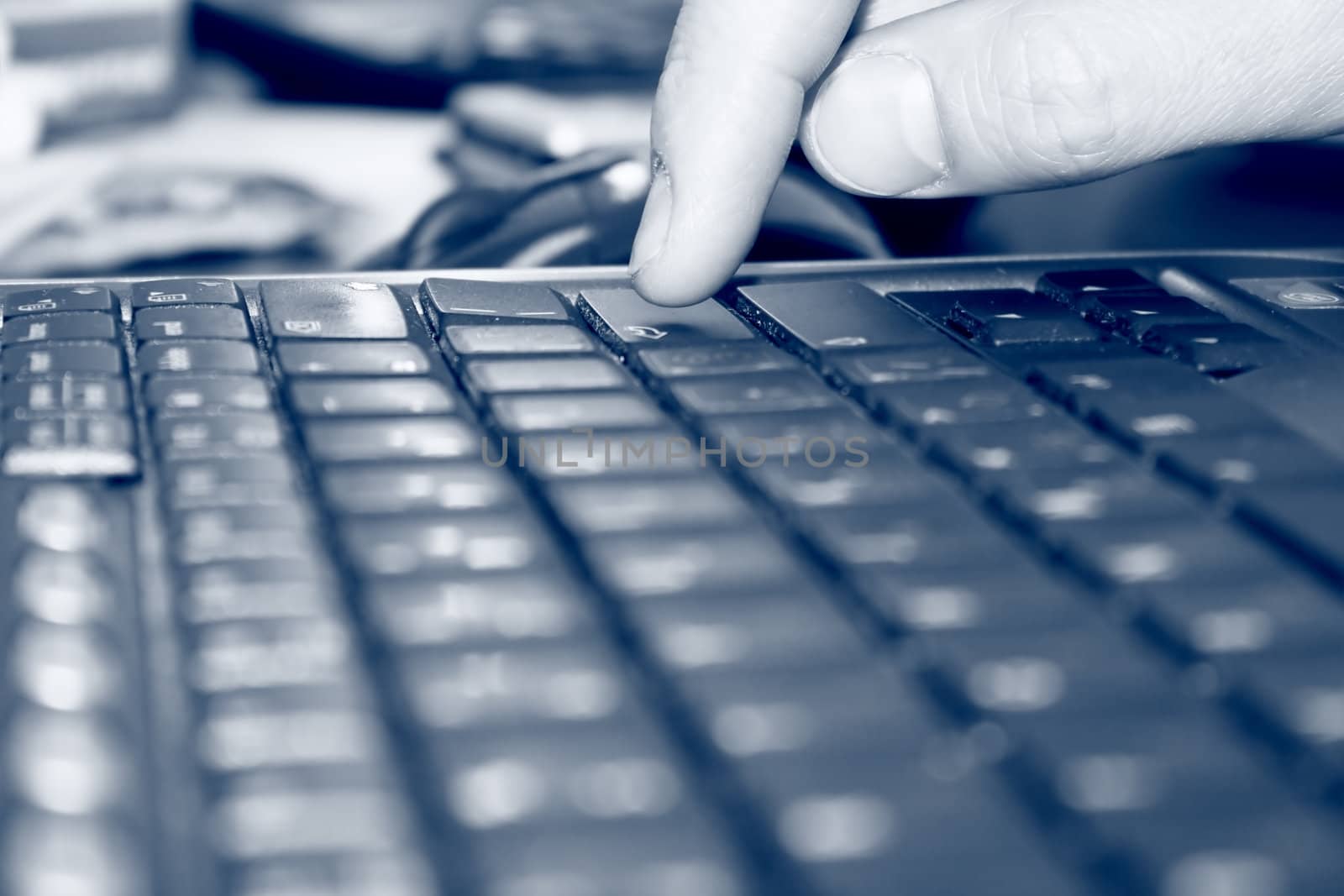 Man's finger on "enter" key
